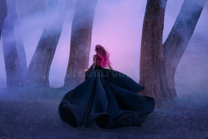 The queen in black dress, runs away in the fog. The skirt train is waving in the wind like a black flower. Pink long royalty free stock photos The queen in black dress, runs away in the fog. The skirt train is waving in the wind like a black flower. Pink long royalty free stock photos