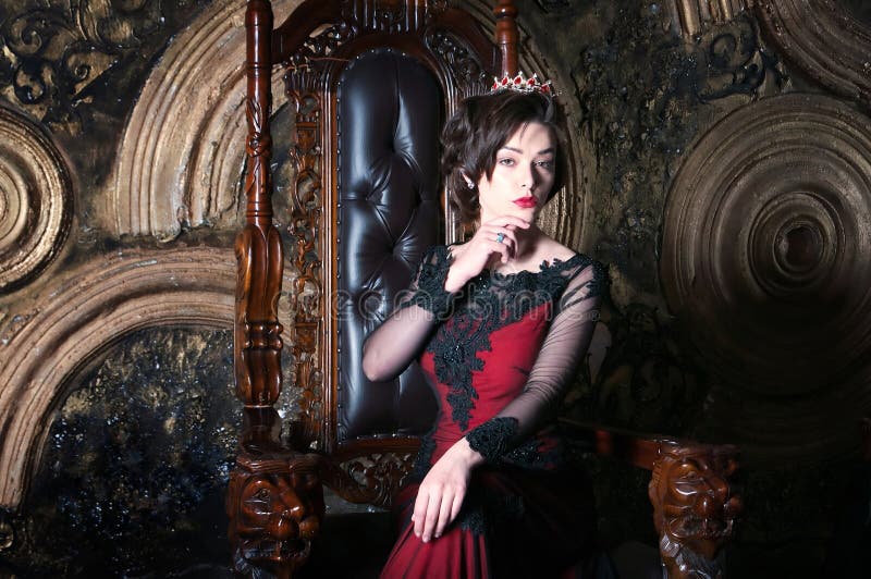 Queen in Red Dress Sitting on Throne. Symbol of Power and Wealth Stock ...