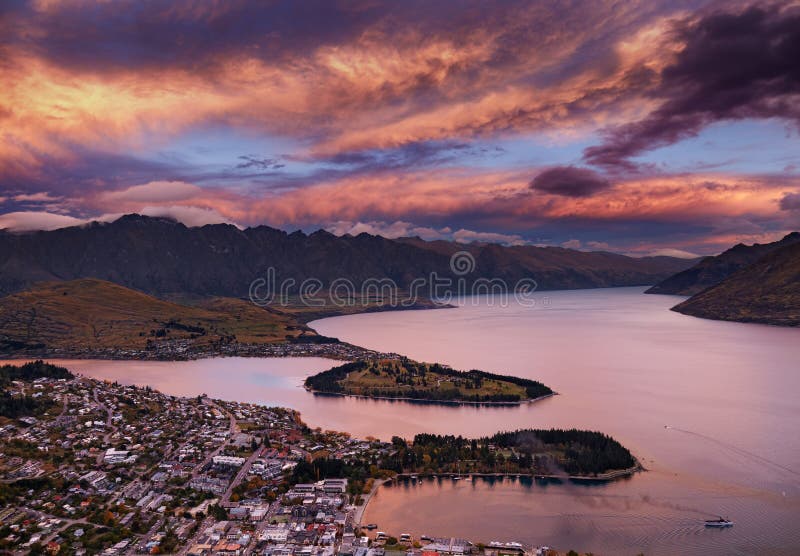 Queenstown cityscape with Wakatipu lake and Remarkables Mountains at sunset, New Zealand. Queenstown cityscape with Wakatipu lake and Remarkables Mountains at sunset, New Zealand