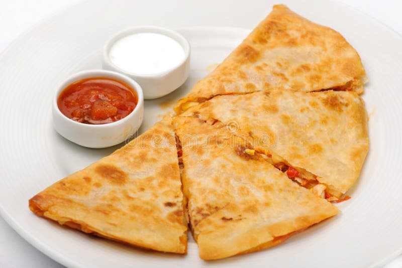Mexican quesadilla with sour cream and tomato souse. Mexican quesadilla with sour cream and tomato souse