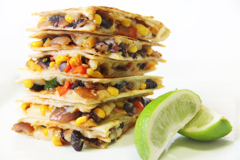 Quesadillas stacked with lime