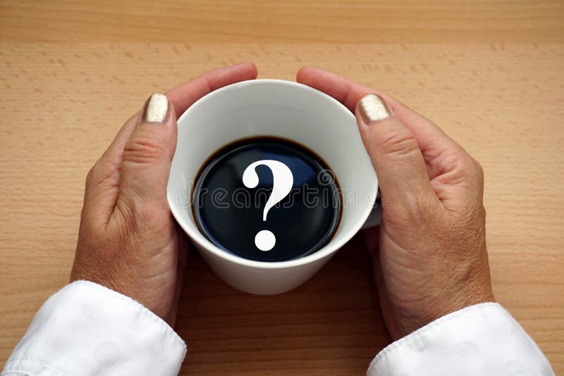 White question mark in a cup of black coffee on a wooden background hold it by the hands of a middle aged woman. Concept image with copy space, divorce, menopause, problem, sign, dilemma, loneliness, lonely, bad, news, price, caffeinated, women, female, drinking, beverage, holding, free, stock, emotions, feelings, diagnosis, questioned, business, symbol, thinking, adult, doubt, confusion, choice, decision, uncertainty, thoughtful, pensive, ask, expression, addiction, aging