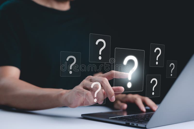 Question Mark and Problem Solving Concept. A person using a laptop with floating question marks, symbolizing brainstorming stock photography