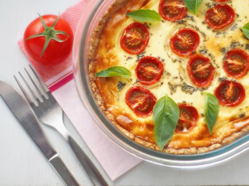 Quiche Lorraine. Traditional French savory pie. Homemade tart with cherry tomato and leek. Top view. stock photos Quiche Lorraine. Traditional French savory pie. Homemade tart with cherry tomato and leek. Top view. stock photos