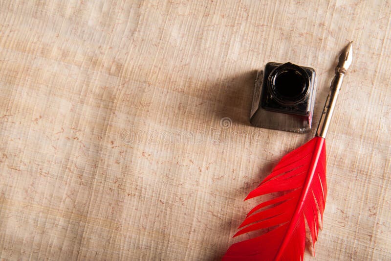Quill pen and papyrus paper royalty free stock photos