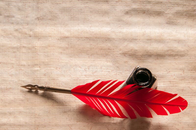 Quill pen and papyrus paper royalty free stock photos