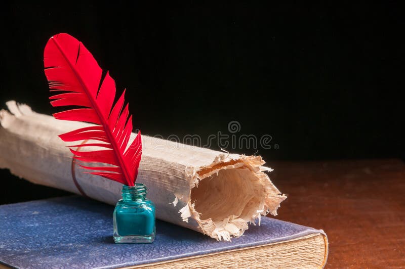 Quill pen and papyrus paper royalty free stock photo