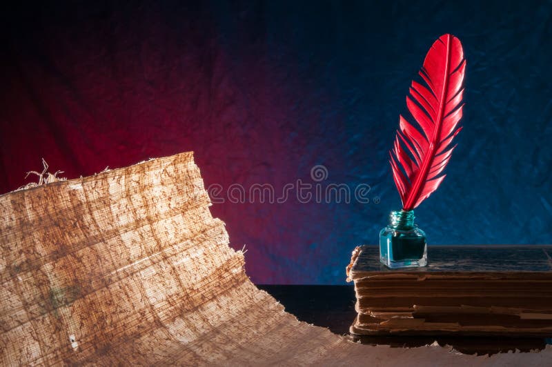 Quill pen and papyrus sheet royalty free stock images