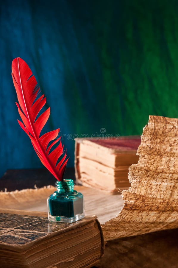 Quill pen and papyrus sheet royalty free stock photography