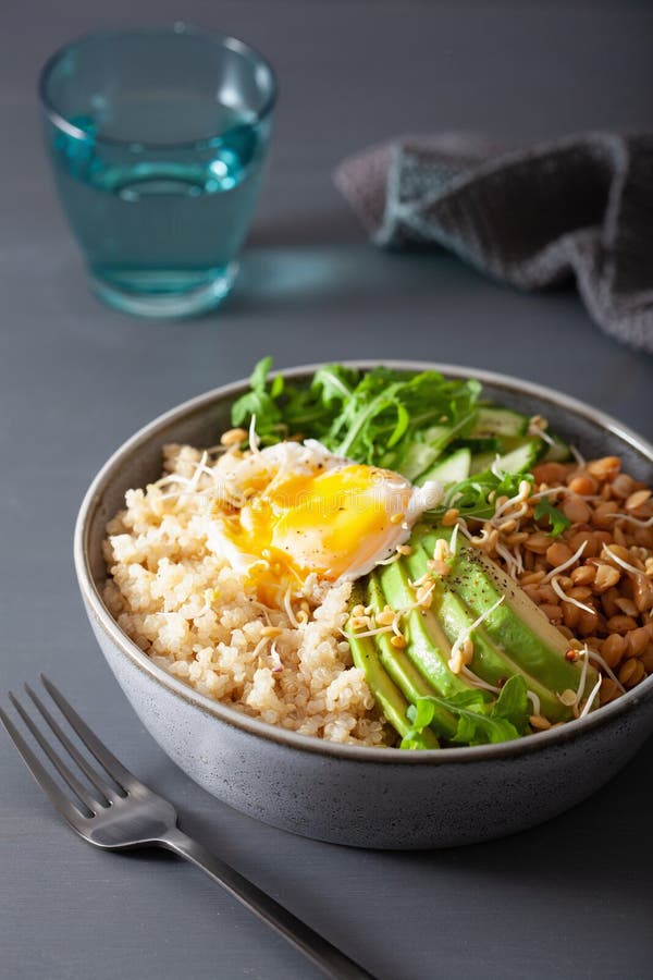 Quinoa bowl with egg, avocado, cucumber, lentil. Healthy vegetarian lunch stock image Quinoa bowl with egg, avocado, cucumber, lentil. Healthy vegetarian lunch stock image