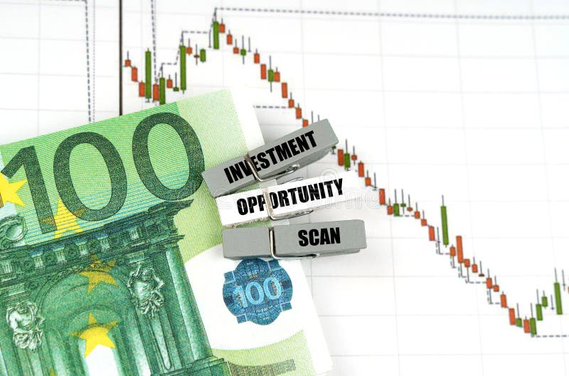 On the quote chart there are euros and clothespins with the inscription - Investment Opportunity Scan stock images