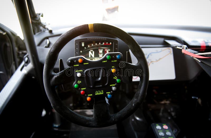 Race Car Driver Point of View Inside Cockpit, Steering Wheel with Knobs