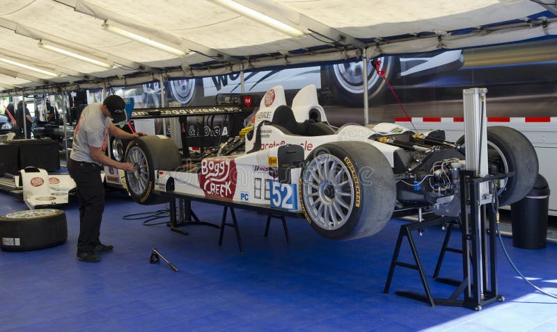 race technician secures wheel editorial photography image of california wheel works