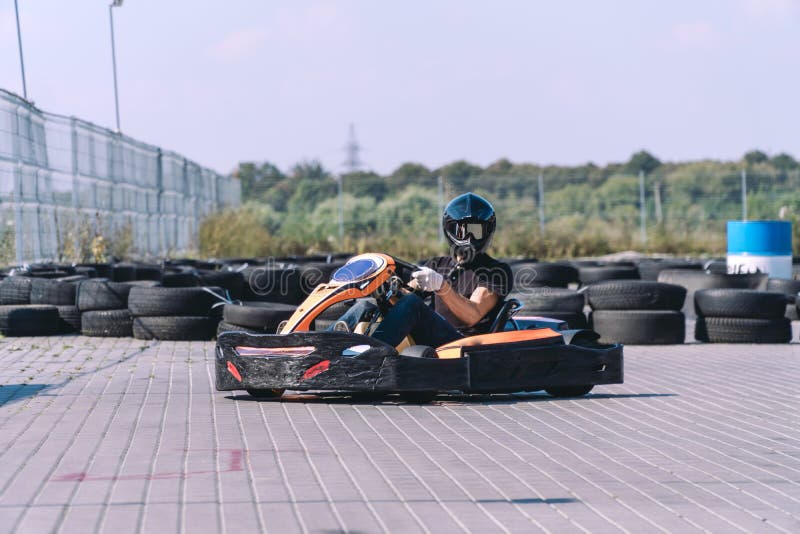Racing car on the track in action, championship, active sports, extreme fun, the driver keeps his hands on the wheel. protective royalty free stock photography Racing car on the track in action, championship, active sports, extreme fun, the driver keeps his hands on the wheel. protective royalty free stock photography