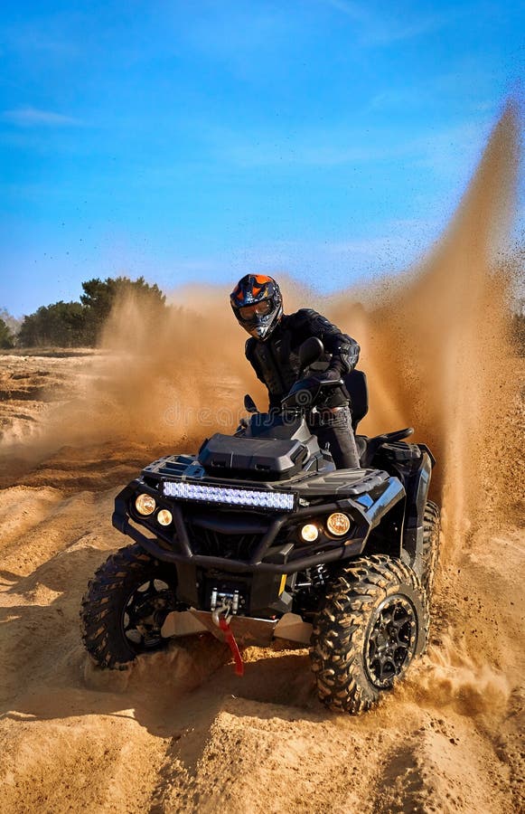 Racing in the Sand on a Fourwheel Drive Quad Stock Image Image of
