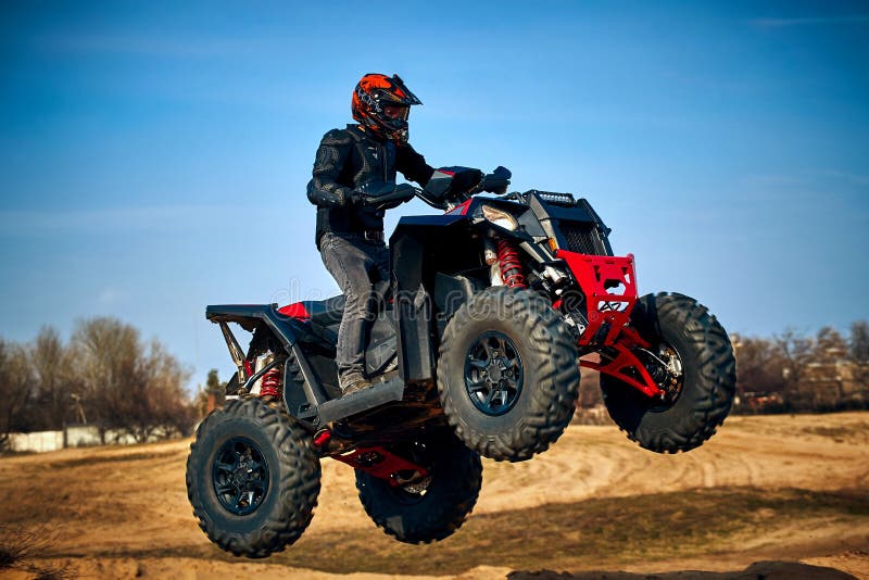 Racing in the Sand on a Fourwheel Drive Quad Stock Image Image of