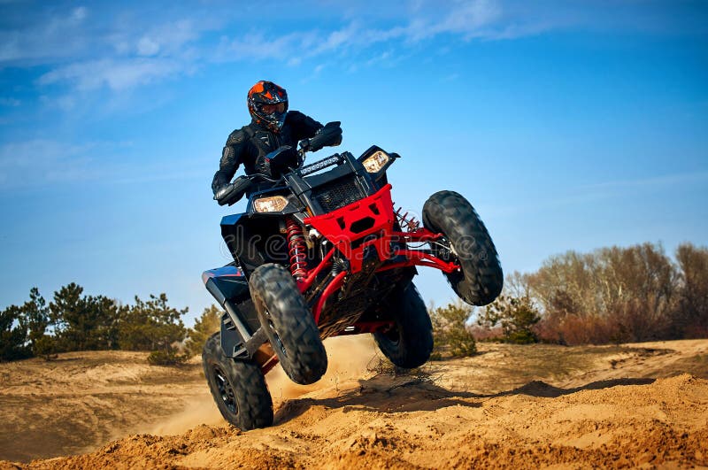 Racing in the Sand on a Fourwheel Drive Quad Stock Photo Image of