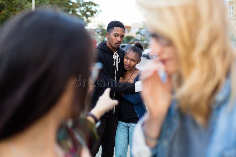 Racism - black couple being bullied