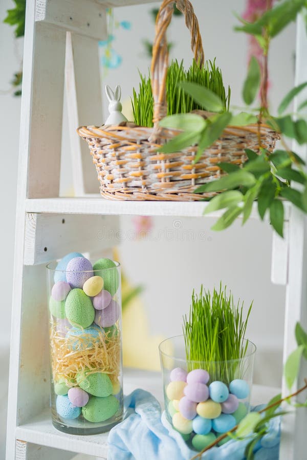 Rack with Beautiful Easter Decorations in Room. Easter Composition