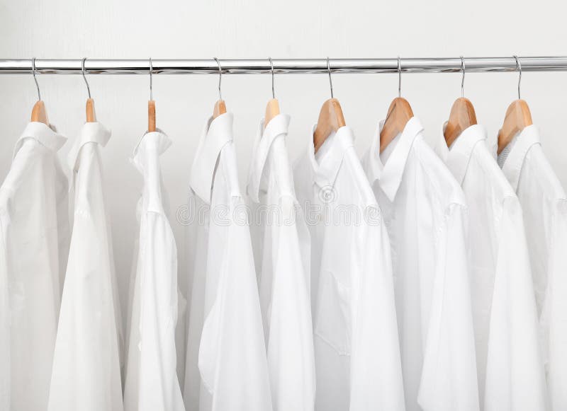 Rack with Clean Clothes after Dry-cleaning Stock Image - Image of ...