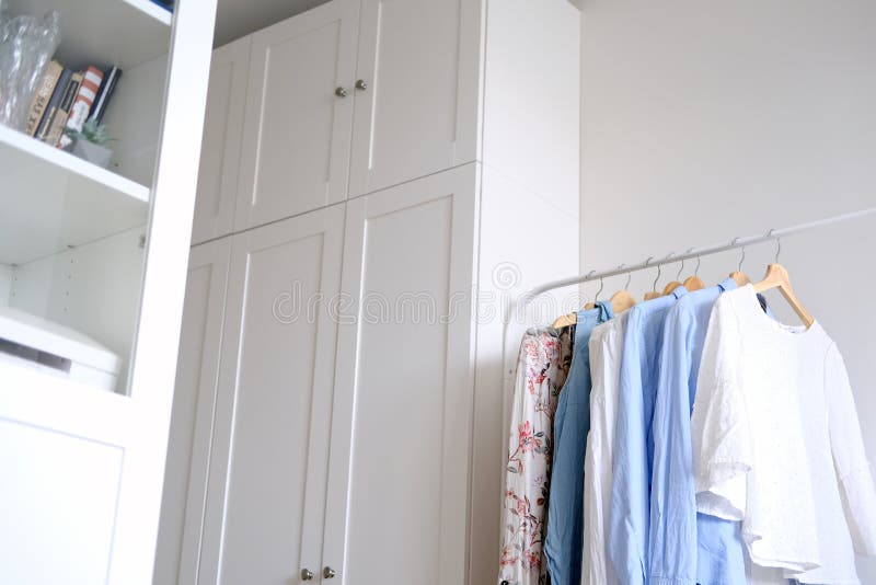 Rack with Hanging Clothes in the Interior of the Dressing Room. Stock Photo Image of clothing