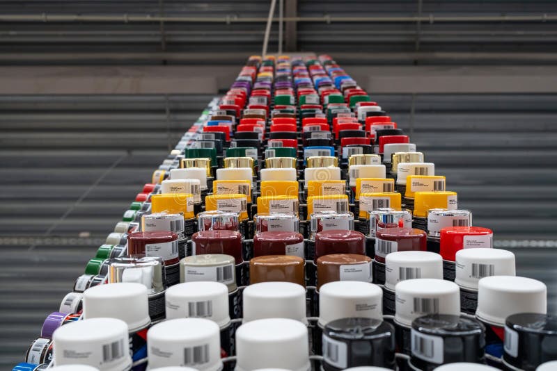 Rack with Multicolored Spray Paint Containers. Art Background. Time To