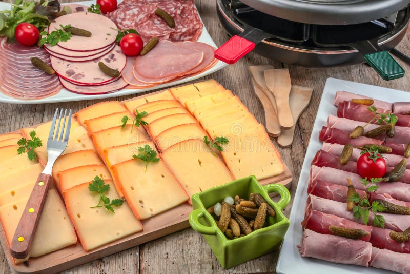 Raclette Cheese and Cold Meats Stock Image Image of board, table