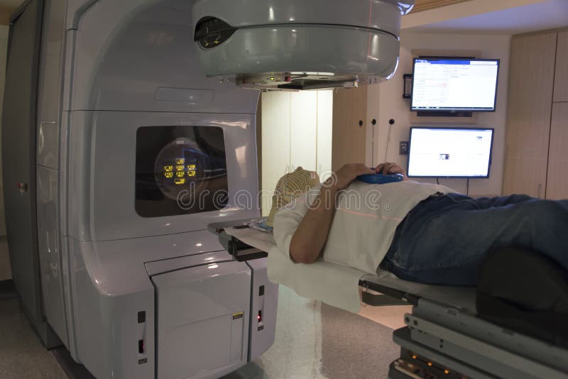 Patient Radiation therapy mask showing laser lines for targeting cancer cells in the brain. Patient Radiation therapy mask showing laser lines for targeting cancer cells in the brain