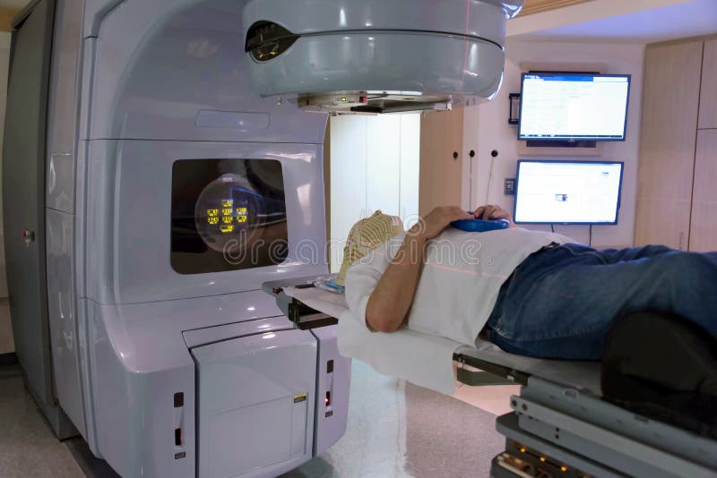 Patient Radiation therapy mask showing laser lines for targeting cancer cells in the brain. Patient Radiation therapy mask showing laser lines for targeting cancer cells in the brain