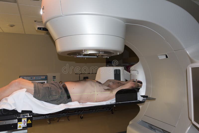 Patient Radiation therapy showing laser lines for targeting cancer cells in the brain and Throat. Patient Radiation therapy showing laser lines for targeting cancer cells in the brain and Throat