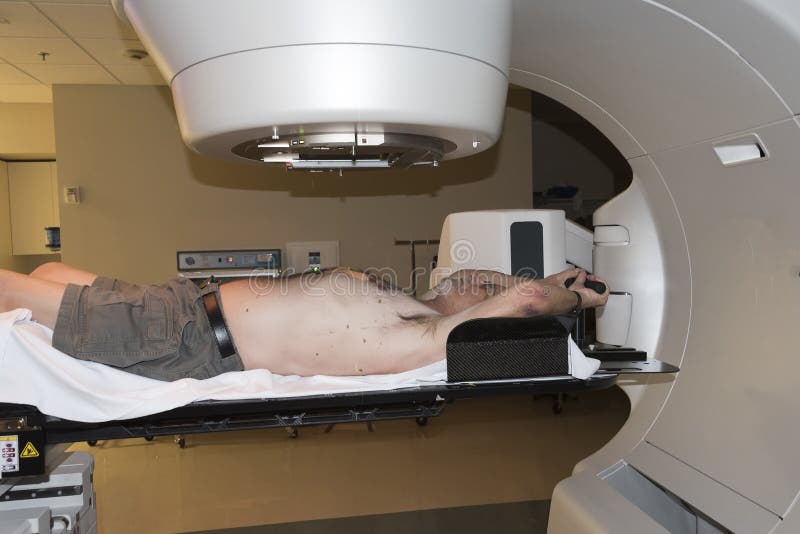 Patient Radiation therapy showing laser lines for targeting cancer cells in the brain and Throat. Patient Radiation therapy showing laser lines for targeting cancer cells in the brain and Throat