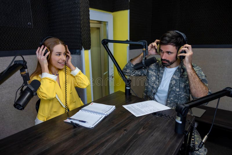 Radio Dj Talking To a Young Singer at the Radio Station Stock Photo