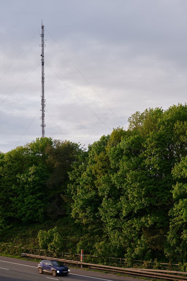 Radio Transmitter Mast and Motorway with Passing Cars Stock Image