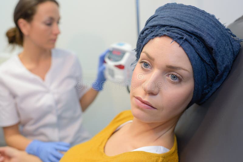 Radiologic technician and patient being scanned female. Radiologic technician and patient being scanned female