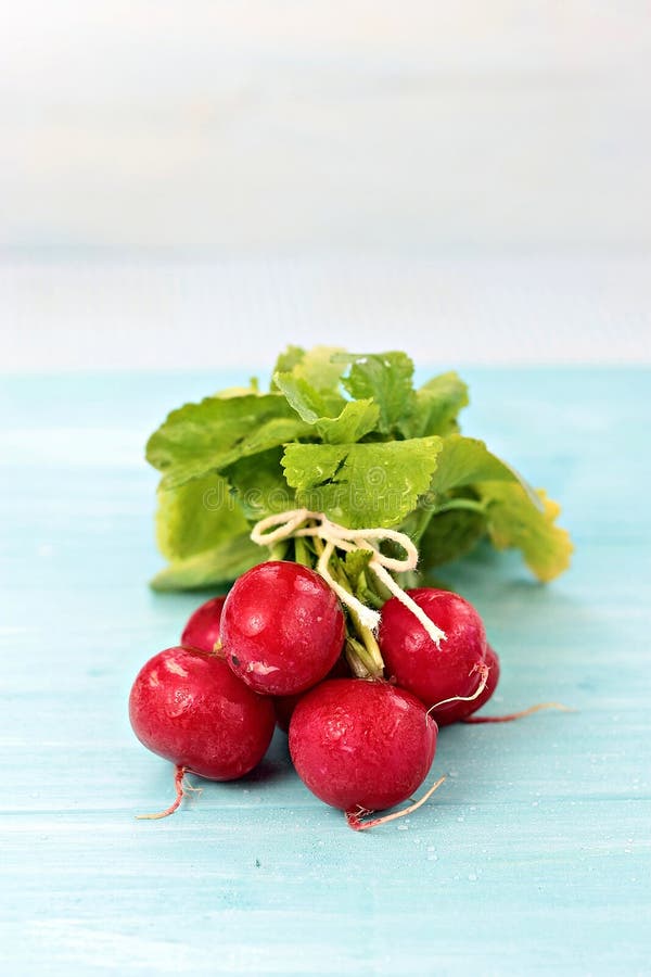 Radishes on blue board