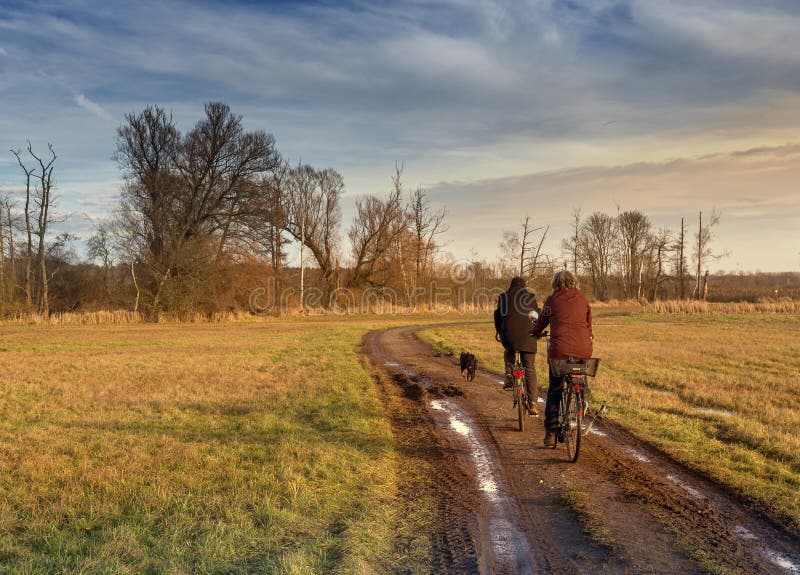 Cyclist in autumn on a small dirt road royalty free stock images Cyclist in autumn on a small dirt road royalty free stock images