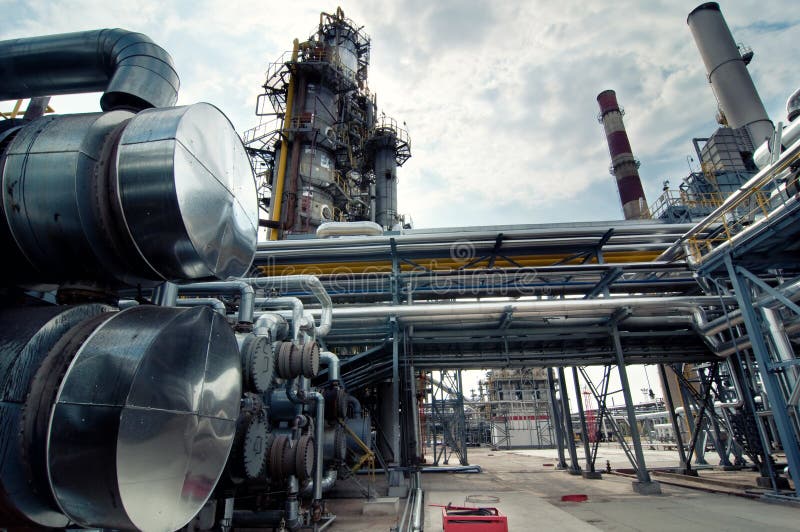 The towers and pipes of an oil refinery. The towers and pipes of an oil refinery.