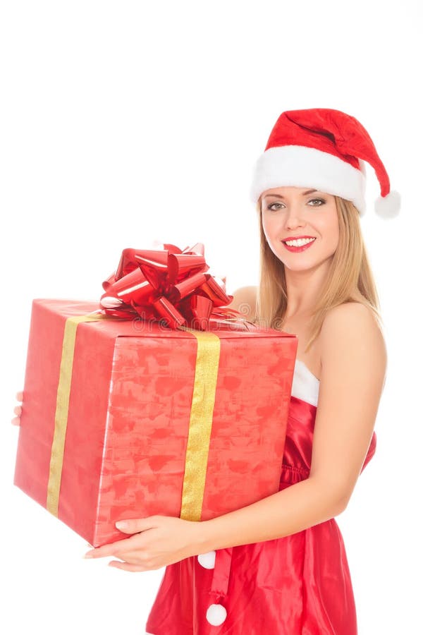 Ragazza allegra dell'assistente della Santa con il grande contenitore di regalo immagini stock Ragazza allegra dell'assistente della Santa con il grande contenitore di regalo immagini stock