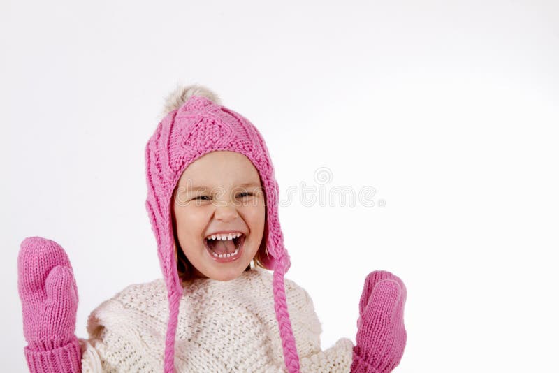 Ragazza in cappello tricottato e guanti fotografia stock Ragazza in cappello tricottato e guanti fotografia stock