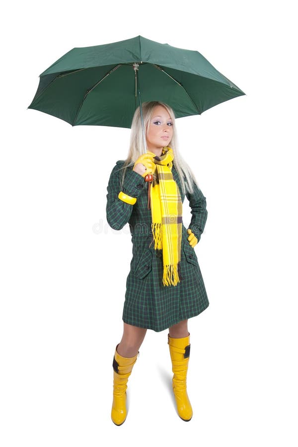 Ragazza in cappotto verde con l'ombrello fotografia stock Ragazza in cappotto verde con l'ombrello fotografia stock