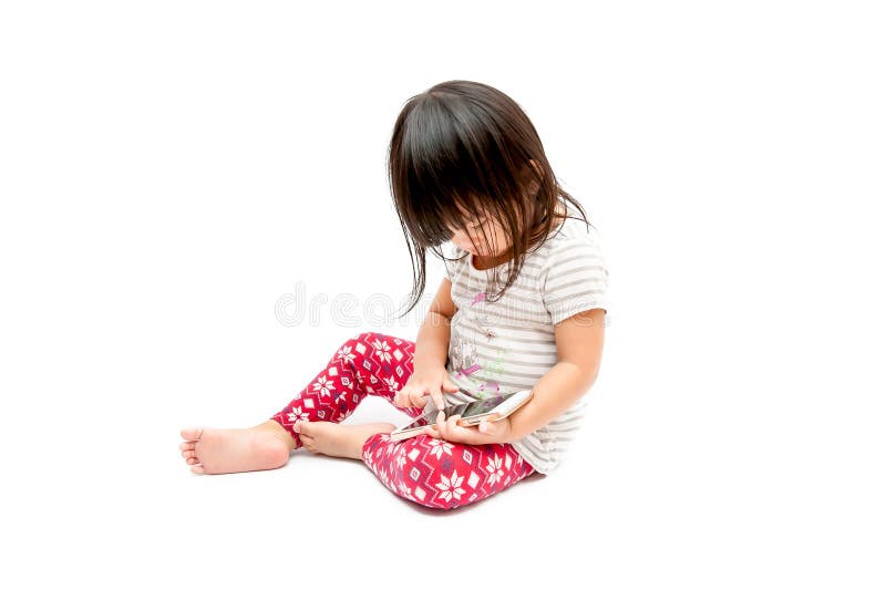 Ragazza che gioca telefono fotografia stock Ragazza che gioca telefono fotografia stock