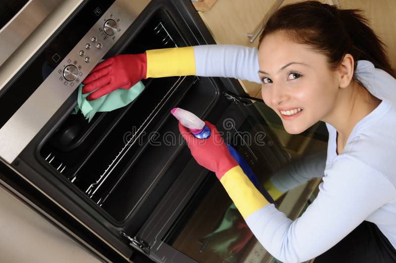 Girl is cleaning the microwave oven. young women worker. Girl is cleaning the microwave oven. young women worker.