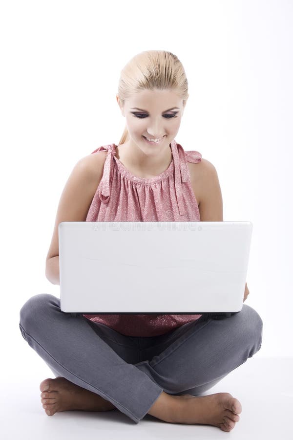 Ragazza con il computer portatile fotografia stock