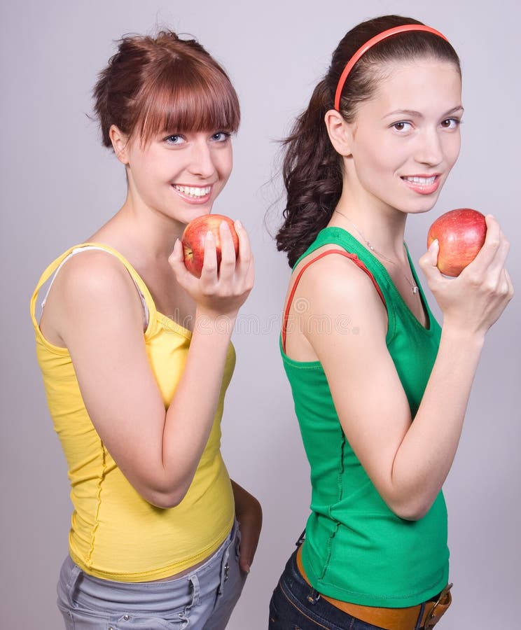 Ragazze con le mele fotografia stock Ragazze con le mele fotografia stock
