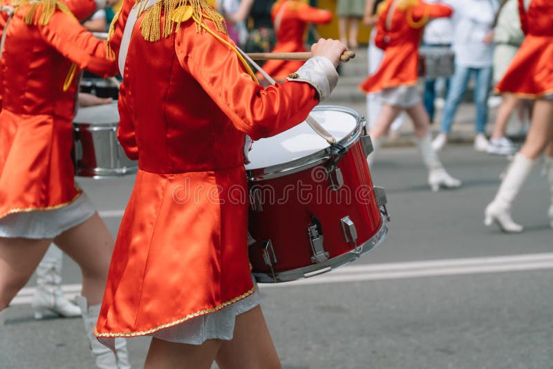 Young girls drummer at the parade. Street performance. Majorettes in the parade. Young girls drummer at the parade. Street performance. Majorettes in the parade