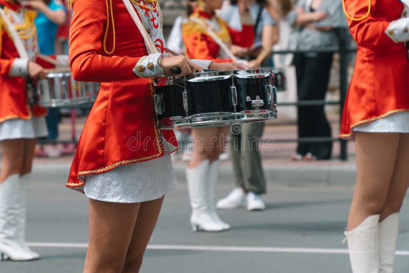 Young girls drummer at the parade. Street performance. Majorettes in the parade. Young girls drummer at the parade. Street performance. Majorettes in the parade