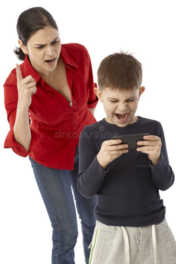 Little boy playing with mother's mobilephone, angry mother warning with finger. Little boy playing with mother's mobilephone, angry mother warning with finger.