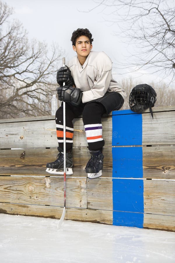 Ragazzo del giocatore di hokey. fotografia stock Ragazzo del giocatore di hokey. fotografia stock