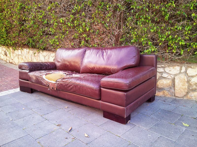 ragged-leather-sofa-dumped-street-brown-