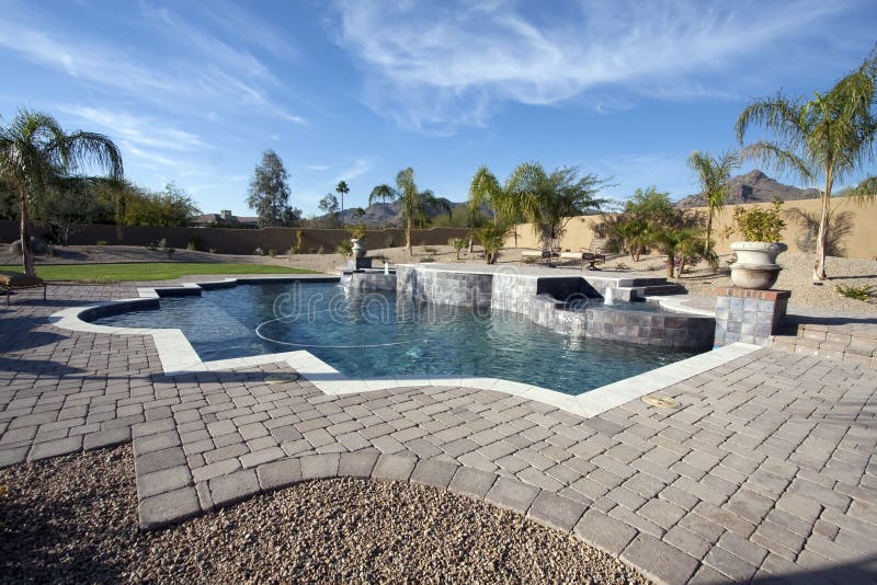 Arizona desert mansion's unique pool with tile patio, fountains, hot spas, waterfalls and mountain view. Arizona desert mansion's unique pool with tile patio, fountains, hot spas, waterfalls and mountain view.